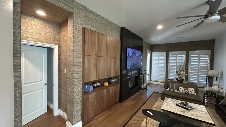 Natural grasscloth wallcovering installed throughout a finished residential living room.